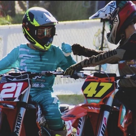 Deacon paice on the start line wearing the quake Teal motocross gear