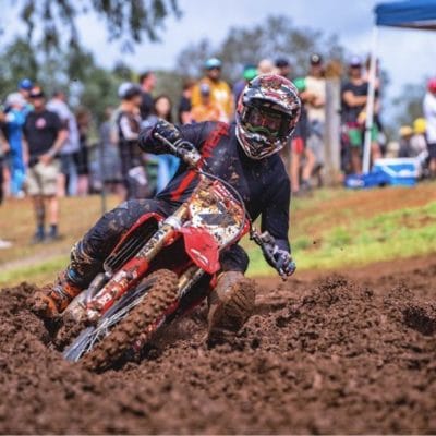 Ryan Gaylor number 7 aboard a 2021 crf 450 kited in a black out pinned motocross gear